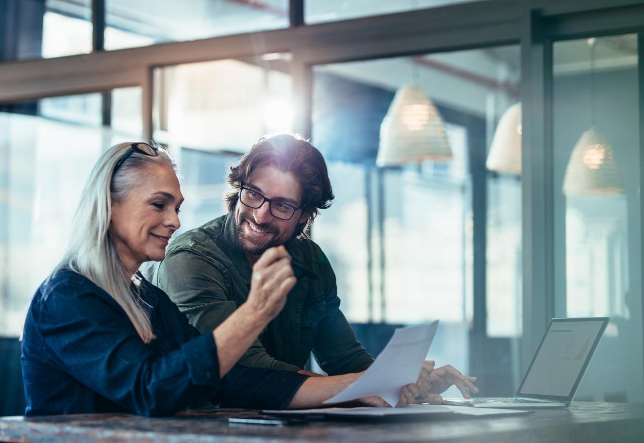 Man and woman looking at documents