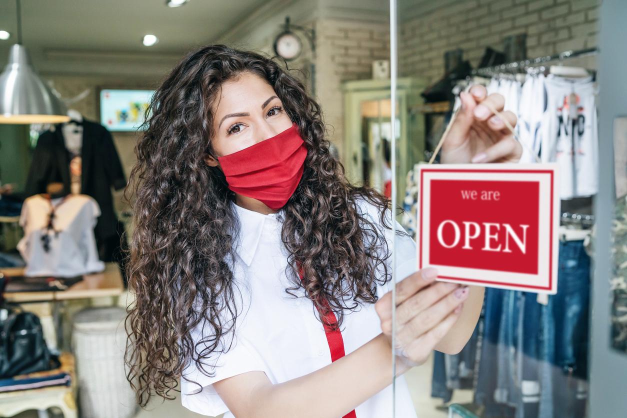 Shop staff member opening up the premises