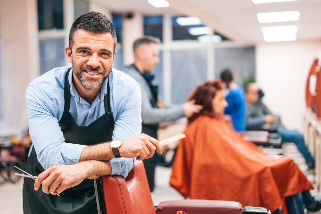 Male hairdresser in salon