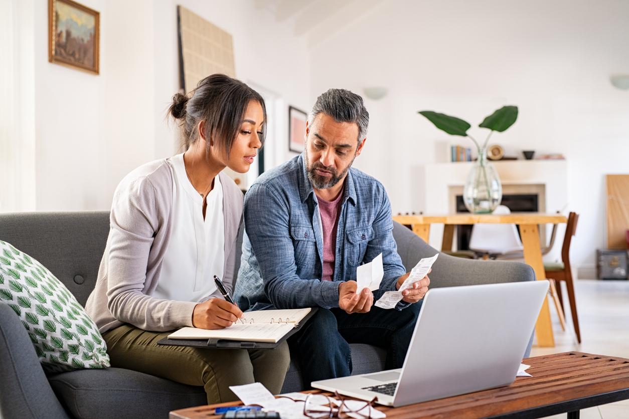 Man and woman look at documents