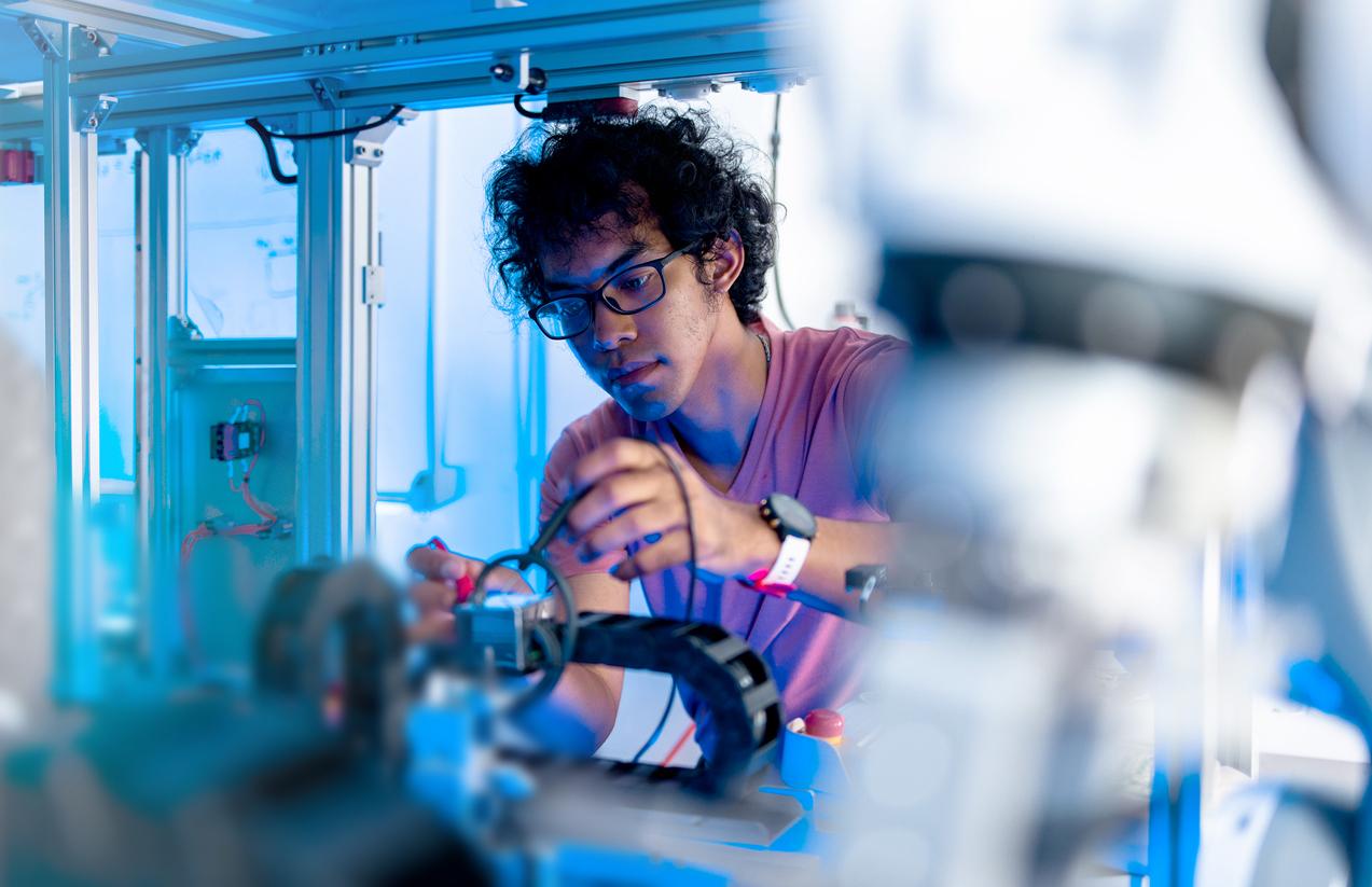 Asian Engineers Maintenance Robot Arm at Lab