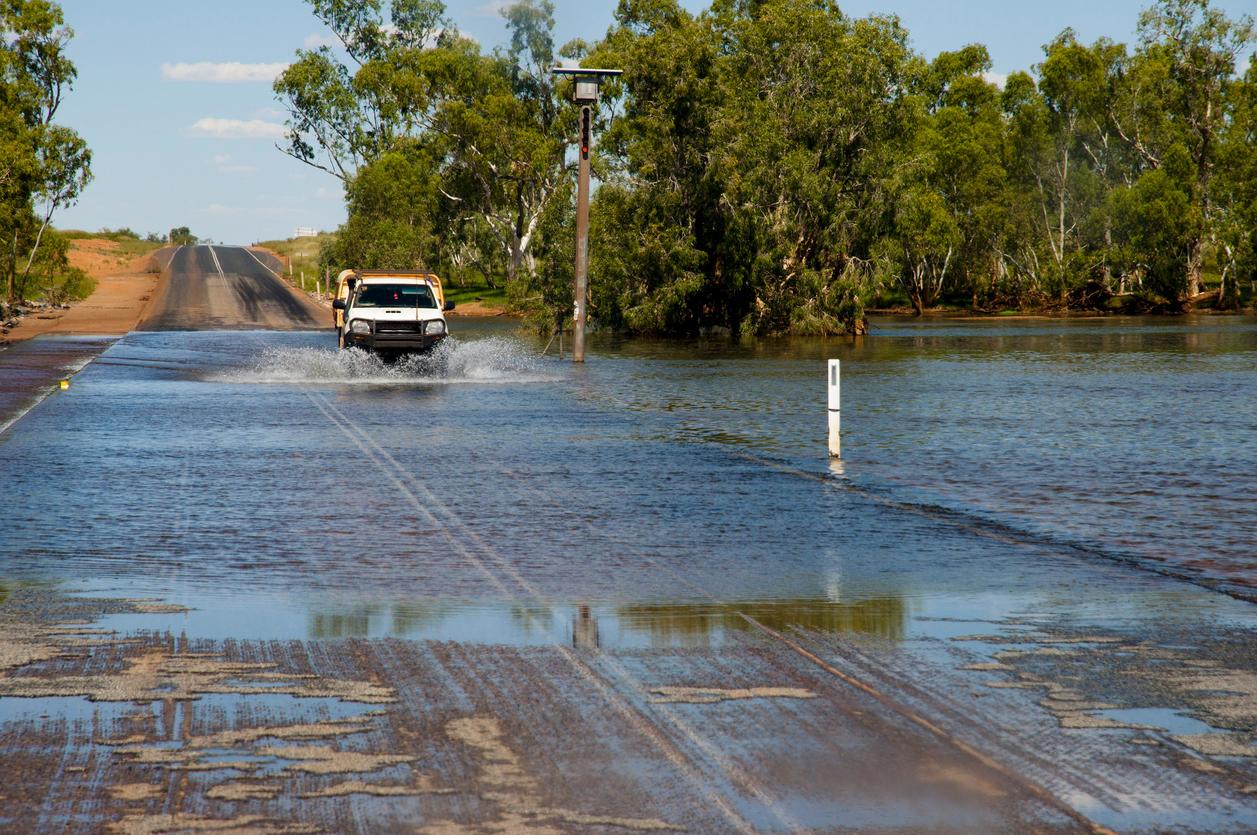 Car driving through flooded road