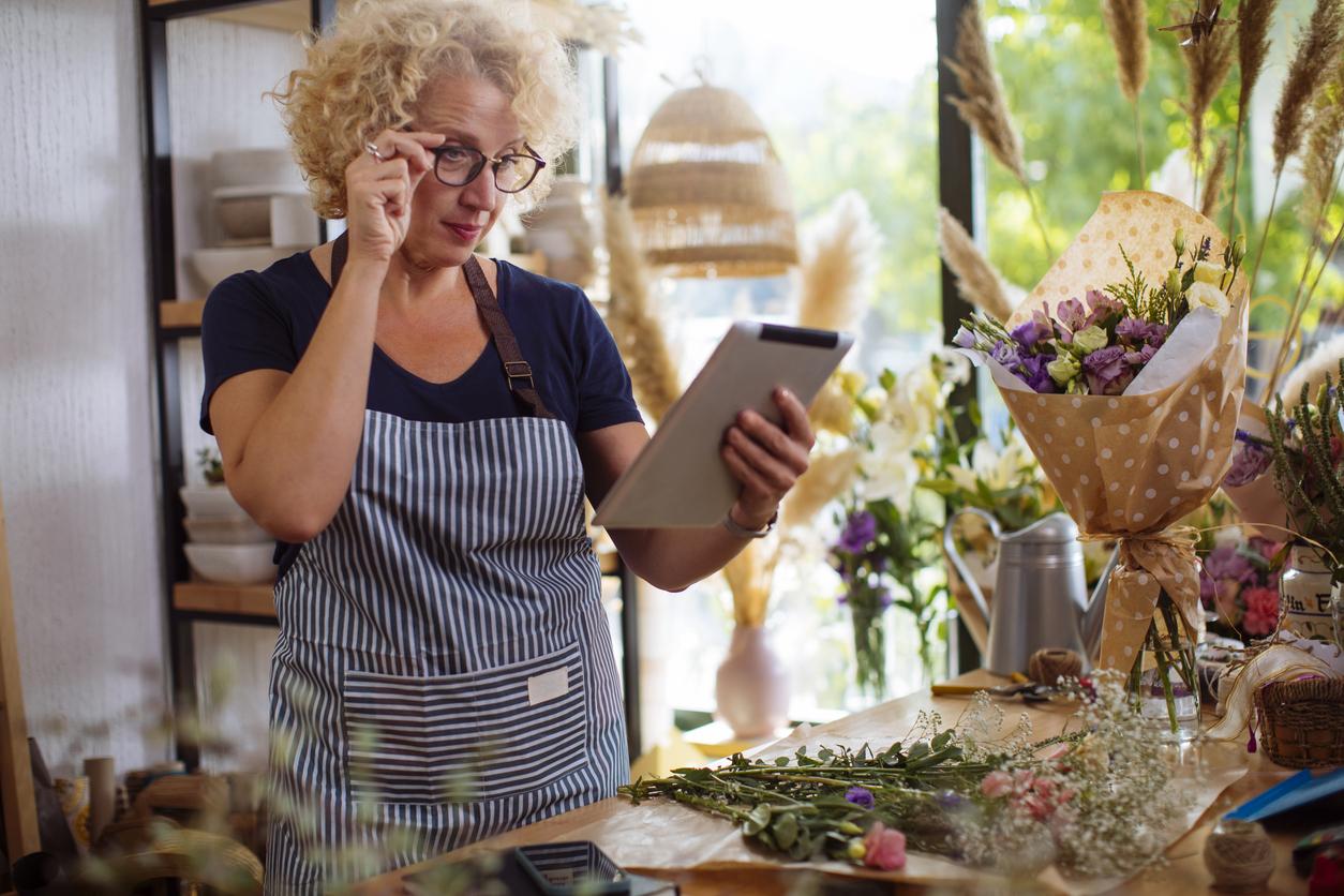 Florist owner keeping an eye on her stock