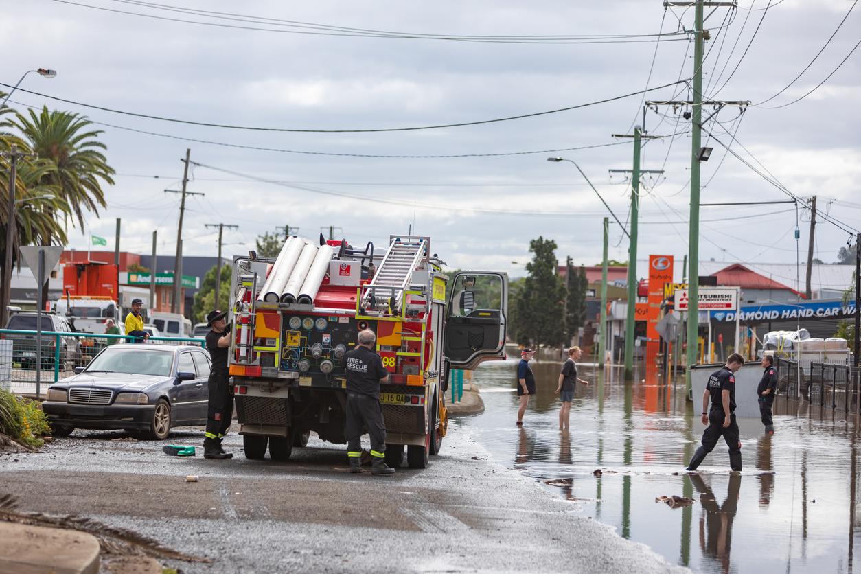 Firefighters help local people with rescues and clean up in town flooded of Lismore