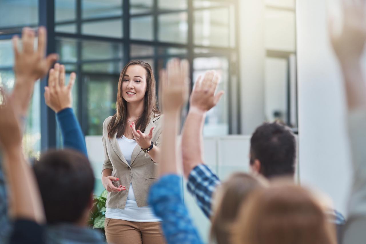 Woman presenting to a crowd