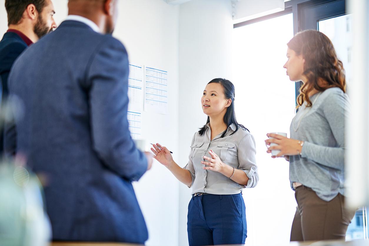 Woman presenting in a business meeting