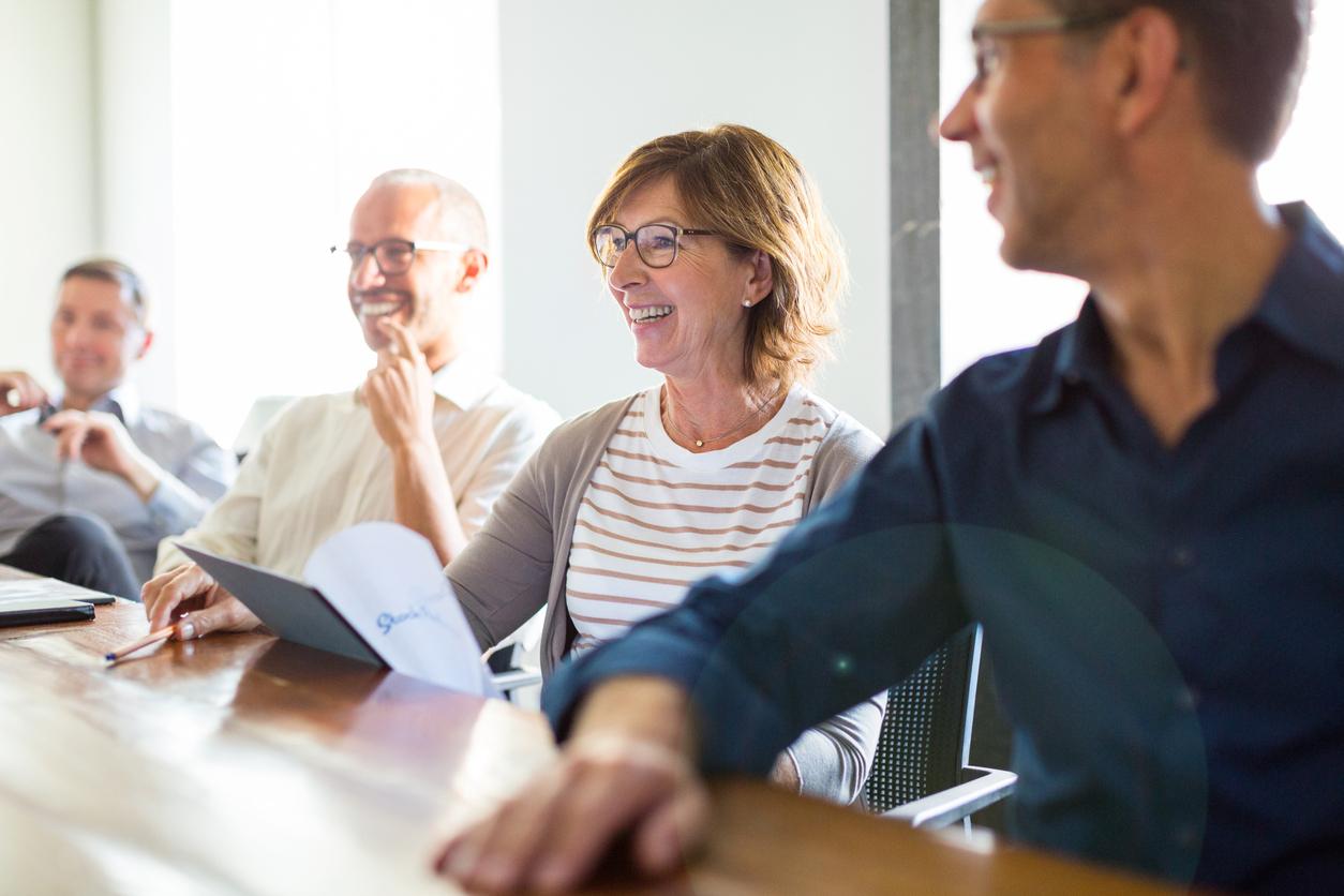 Woman smiling at meeting