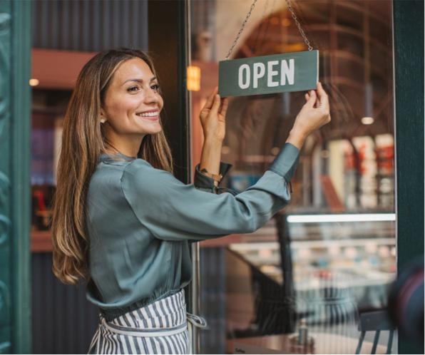 Store owner opening shop