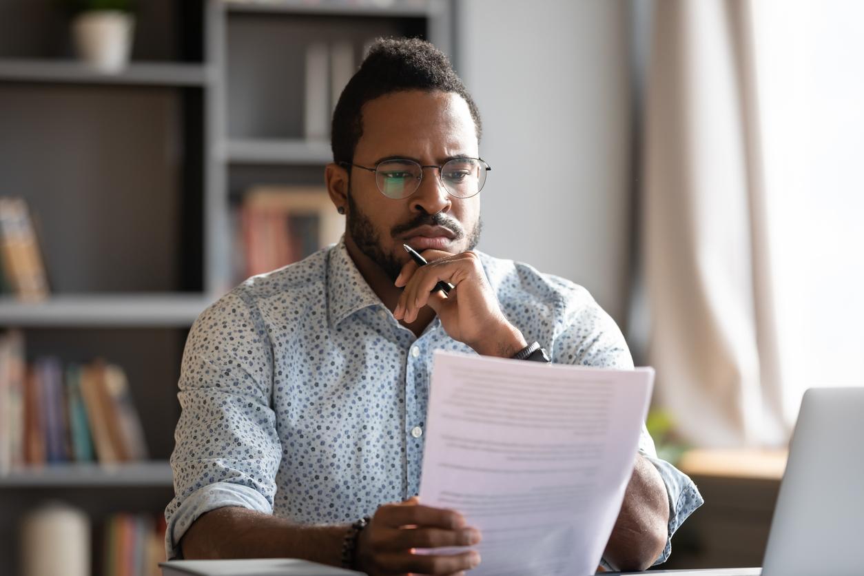 African male lawyer read contract details