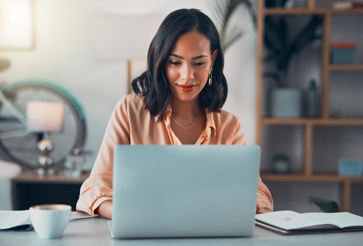 Woman working on laptop online