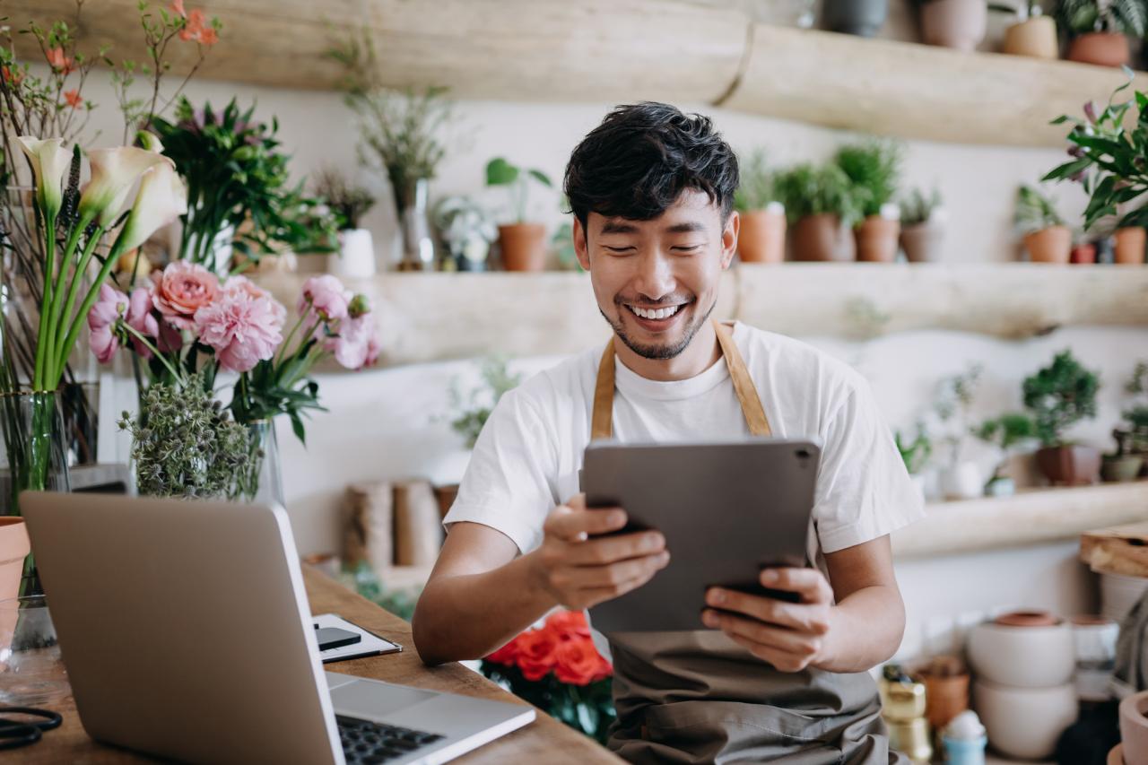 Small business owner using tablet computer