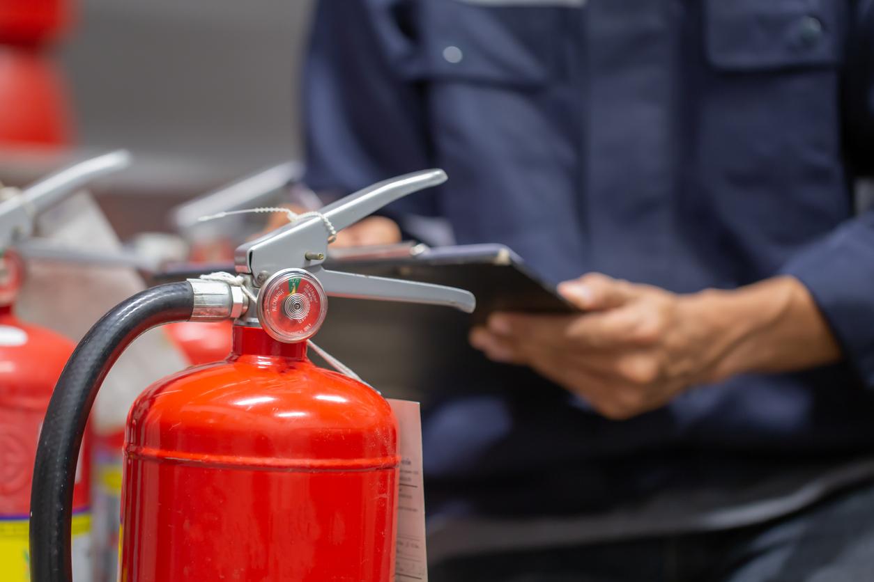 Engineer are checking and inspection a fire extinguishers tank