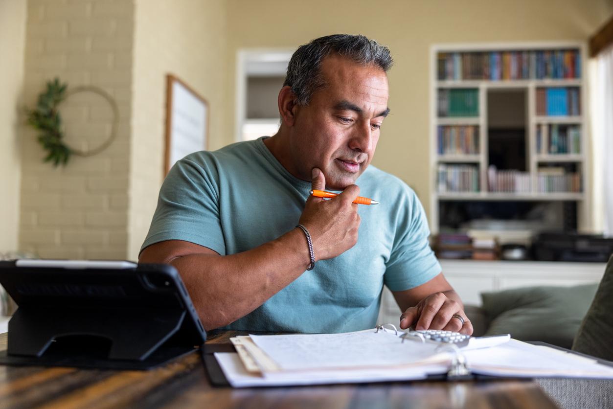 Mature man working from home using a computer