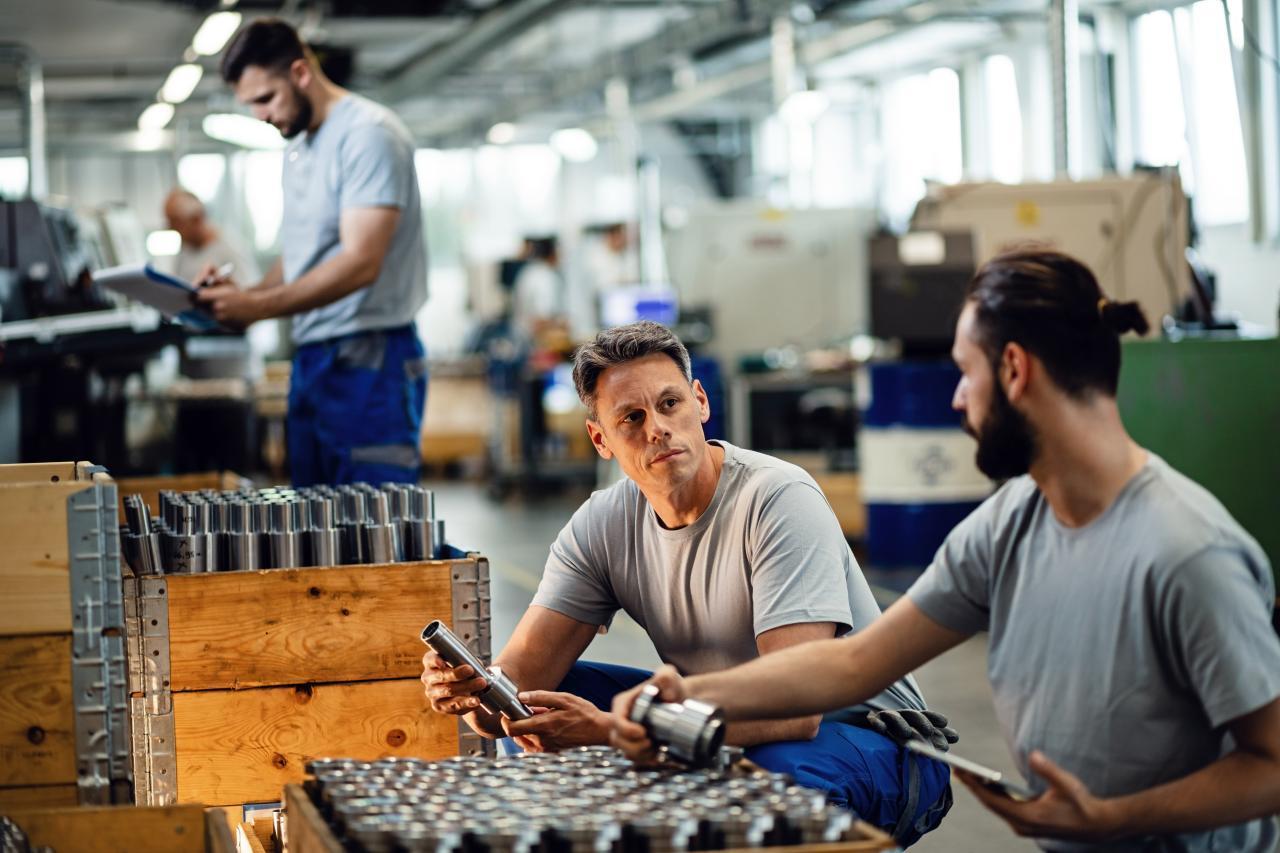 Man talking and looking at tools