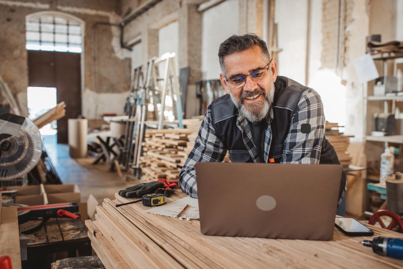 Carpenter in wood workshop