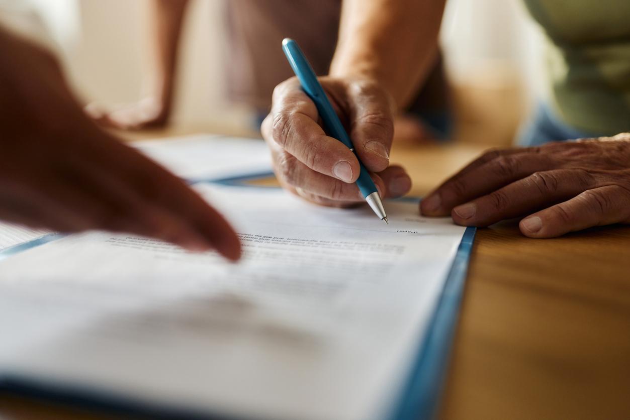 Someone signing document